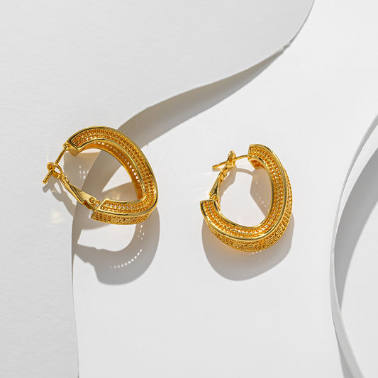 Titanium steel material twisted hollow gold-plated ear buckle simple cold wind fashion earrings personalized earrings earrings wholesale women - NiceOceanJewelry