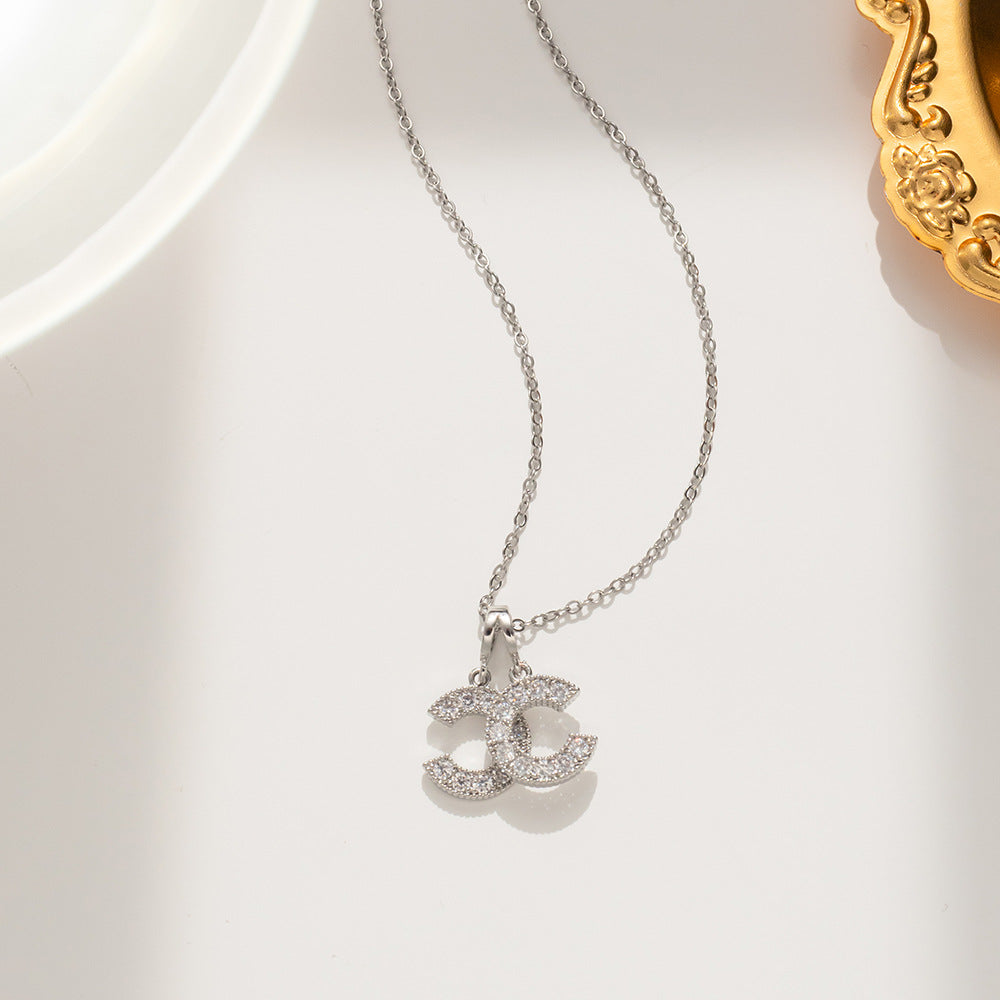 Korean Version of Titanium Steel Double C Necklace Women's Gold Micro-inlaid New Light Luxury Ins Fashion Versatile Model Supports One Piece of Hair