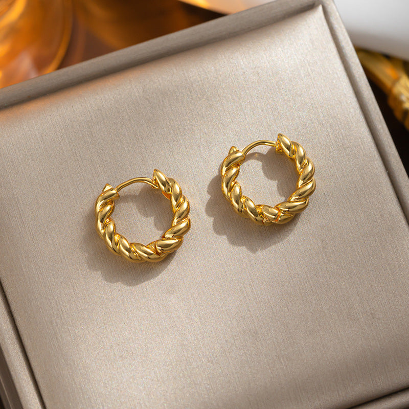 European and American fashion twist ring ear buckle female retro gold-plated simple high-sense ear buckle versatile titanium steel earrings ear buckle