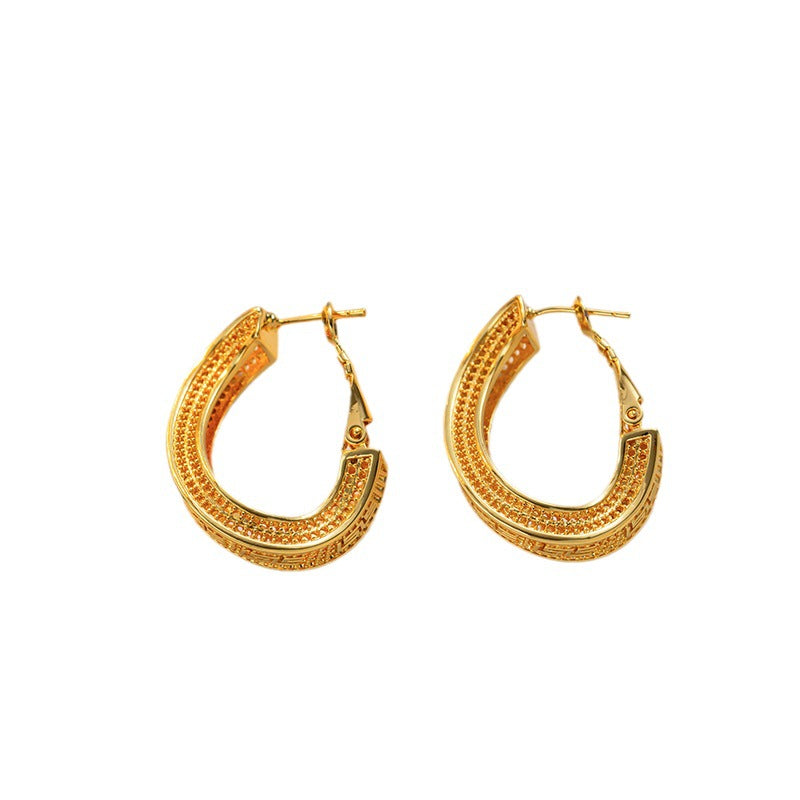 Titanium steel material twisted hollow gold-plated ear buckle simple cold wind fashion earrings personalized earrings earrings wholesale women - NiceOceanJewelry