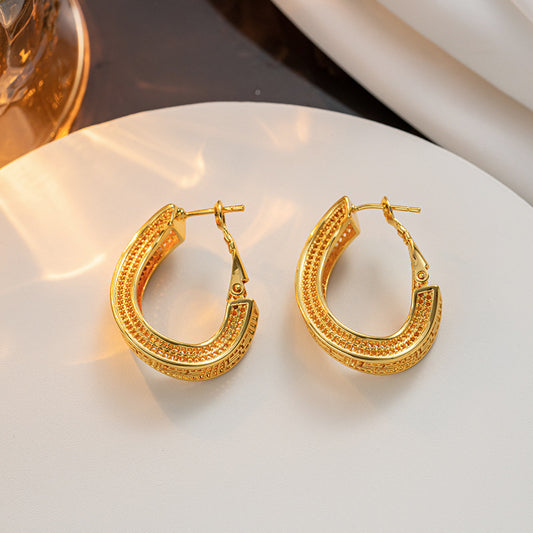 Titanium steel material twisted hollow gold-plated ear buckle simple cold wind fashion earrings personalized earrings earrings wholesale women