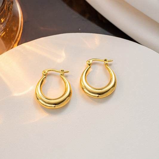Selling French retro European and American niche minimalist oval titanium steel, gold-plated fashion earrings for women